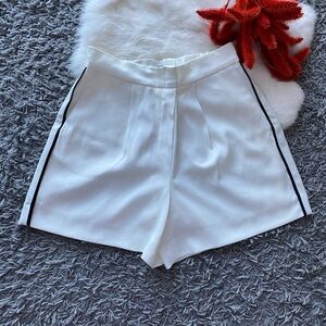 Babaton White High-Waist Shorts with Black Side Stripe